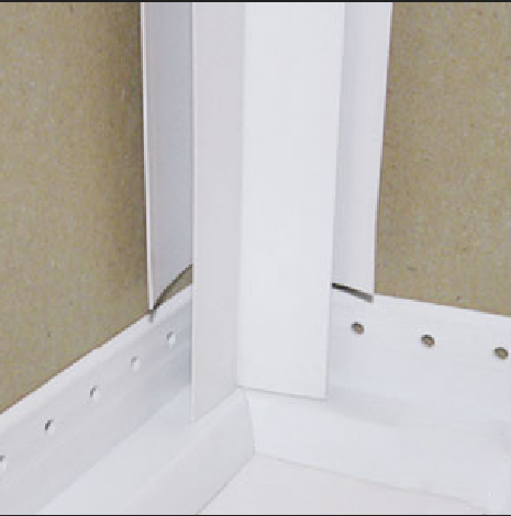 notch corner trim flanges so trim end rests on strip.