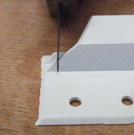 Notch a square out of each mitre cut